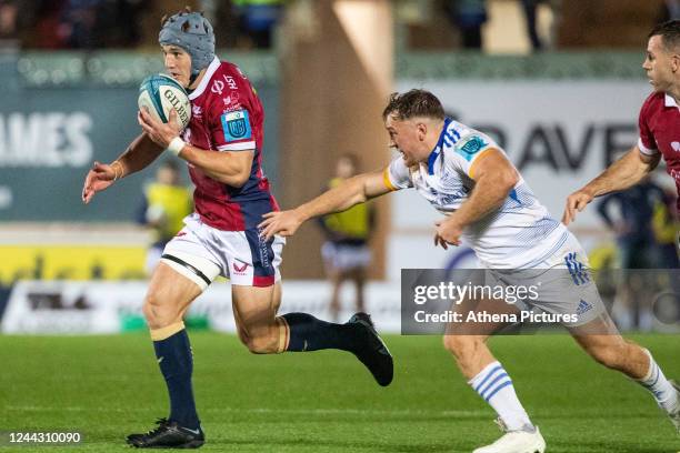 Liam Turner of Leinster tackles Jonathan Davies of the Scarlets during the United Rugby Championship match between the Scarlets and Leinster at Parc...