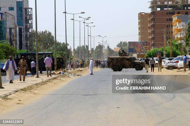 Sudanese security vehicles are stationed near a rally to protest the United Nations mediation, in front of the UN headquarters in the Manshiya...