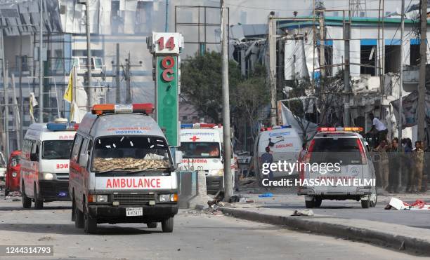 Security personnel and ambulances are stationed near destroyed and damaged buildings after an car bombing targeted the education ministry in...