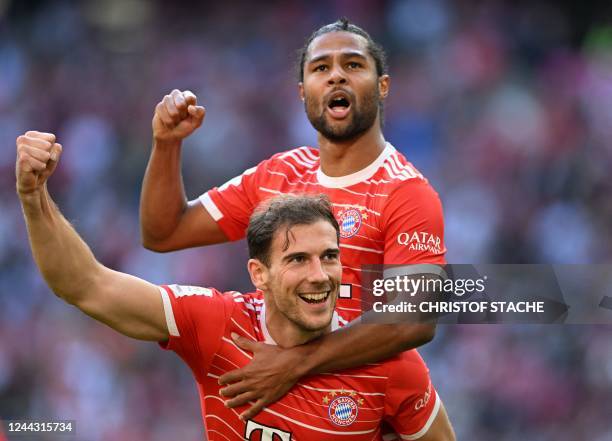 Bayern Munich's German midfielder Leon Goretzka and Bayern Munich's German midfielder Serge Gnabry celebrate scoring the first goal for Munich during...