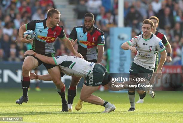 Andre Esterhuizen of Harlequins is tackled by Mike Willemse of London Irish during the Gallagher Premiership Rugby match between Harlequins and...