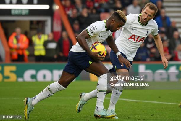 Tottenham Hotspur's English midfielder Ryan Sessegnon celebrates with Tottenham Hotspur's English striker Harry Kane after scoring their first goal...