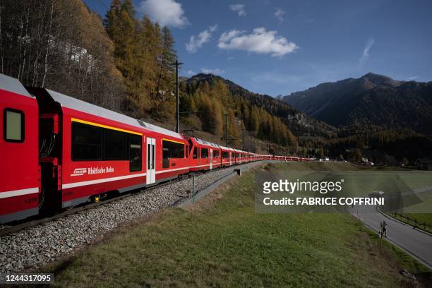 Metre-long train with 100 cars passes by in Bergun on October 29 during a record attempt by the Rhaetian Railway of the World's longest passenger...