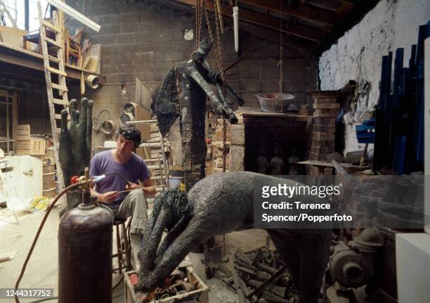 Irish sculptor Edward Delaney , known in particular for his lost-wax bronze castings, at work in his sculpture studio, circa 1970.