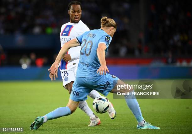 Paris Saint-Germain's Portuguese midfielder Renato Sanches fights for the ball with Troyes' French forward Renaud Ripart during the French L1...