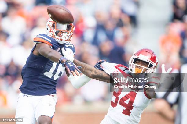 Wide receiver Warren Thompson of the Arkansas Razorbacks looks to catch a pass in front of cornerback Nehemiah Pritchett of the Auburn Tigers during...