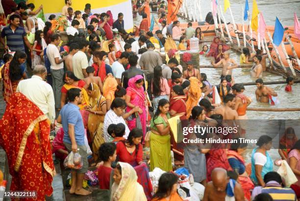 Devotees take a dip in the Ganga River on the occasion of Kharna Pooja as part of the Chhath Pooja festival at Gandhi Ghat, on October 29, 2022 in...