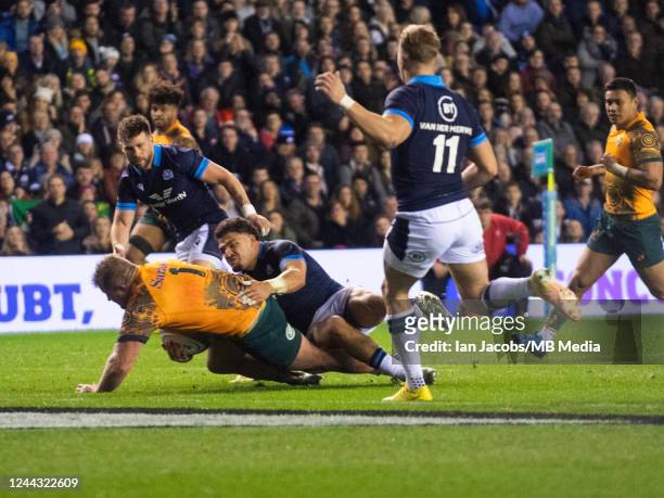Australian Prop, James Slipper, powers his way through the home defence to make the score 15-13 to the Scots during the Autumn International match...