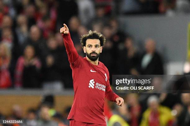 Liverpool's Egyptian striker Mohamed Salah celebrates scoring his team's first goal during the English Premier League football match between...