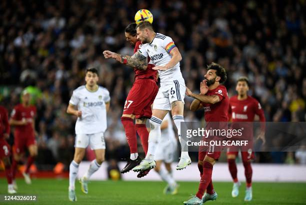 Liverpool's Uruguayan striker Darwin Nunez jumps up to head the ball with Leeds United's English-born Scottish defender Liam Cooper during the...