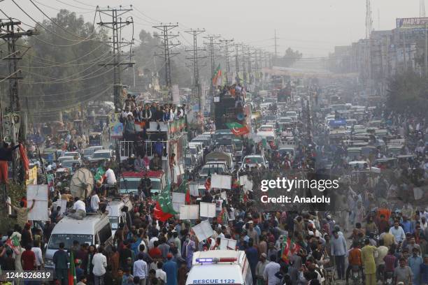 Activists and supporters of opposition party Pakistan Tehreek-e-Insaf take part in an anti-government long march towards Islamabad to demand early...