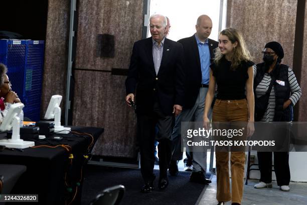 President Joe Biden arrives to vote early in the midterm elections with his granddaughter Natalie Biden in Wilmington, Delaware on October 29, 2022....