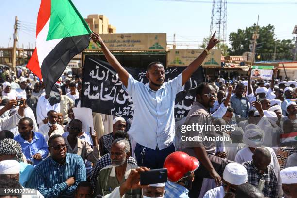 Sudanese demonstrators rally to protest the United Nations mediation, in front of the UN headquarters in the Manshiya district of the capital...