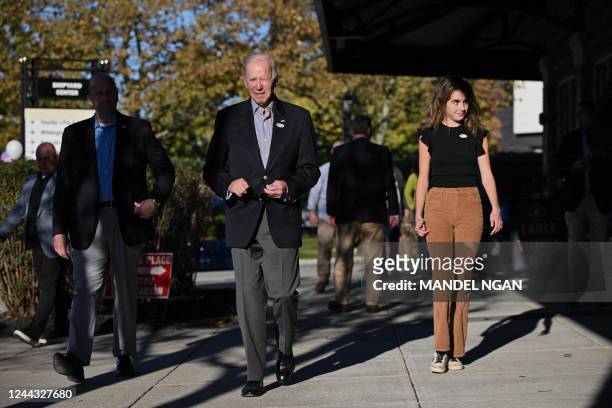 President Joe Biden leaves after voting early in the midterm elections with his granddaughter Natalie Biden in Wilmington, Delaware on October 29,...