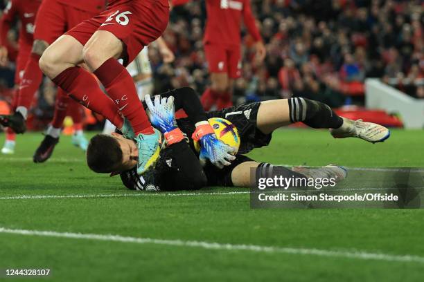 Andy Robertson of Liverpool catches Leeds United goalkeeper Illan Meslier in the face as he saves at his feet during the Premier League match between...