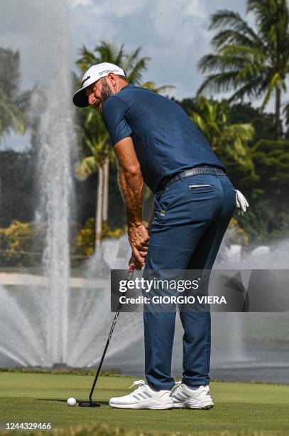 Golfer Dustin Johnson prepares his shot on the ninth hole during the LIV Golf Invitational Miami 2022 at Trump National Doral Miami Golf Club in...