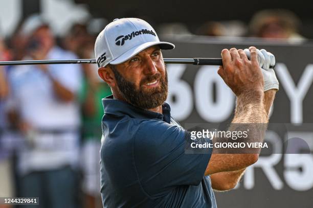 Golfer Dustin Johnson plays his shot from the 9th hole during the semifinals of the LIV Golf Invitational Miami 2022 at the Trump National Doral...