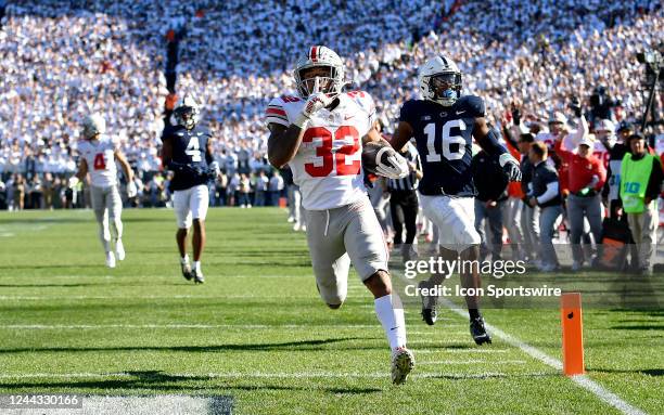 Ohio State running back TreVeyon Henderson celebrates after scoring a long touchdown run during the Ohio State Buckeyes versus Penn State Nittany...