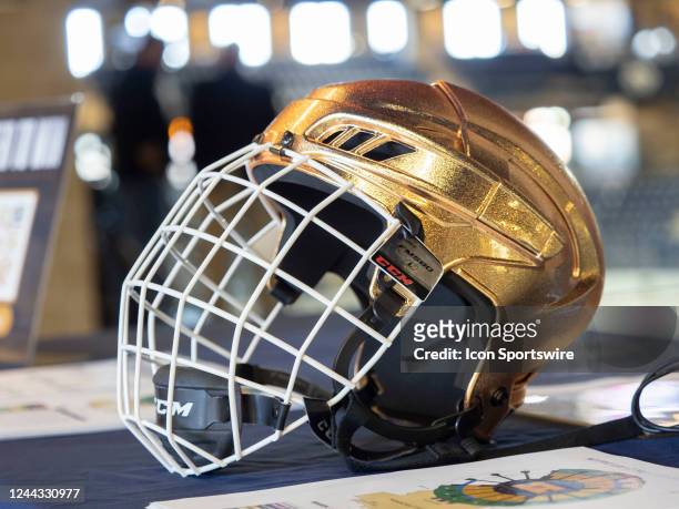 Notre Dame Fighting Irish hockey helmet is placed on the marketing table before a men's college hockey game between the Michigan State Spartans and...