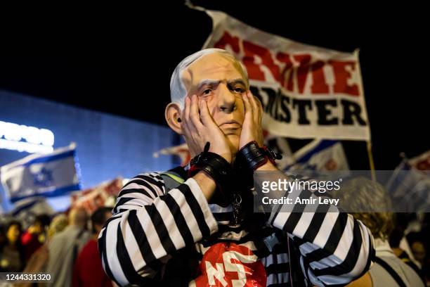 Demonstrator dressed as former Israeli Prime Minister Benjamin Netanyahu in prisoner uniform during a rally against former Israeli Prime Minister...