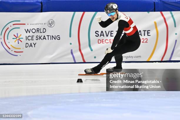 Roberts Kruzbergs of Latvia celebrates after finishing first in the men's 1000 meter final during the ISU World Cup Short Track at Maurice Richard...