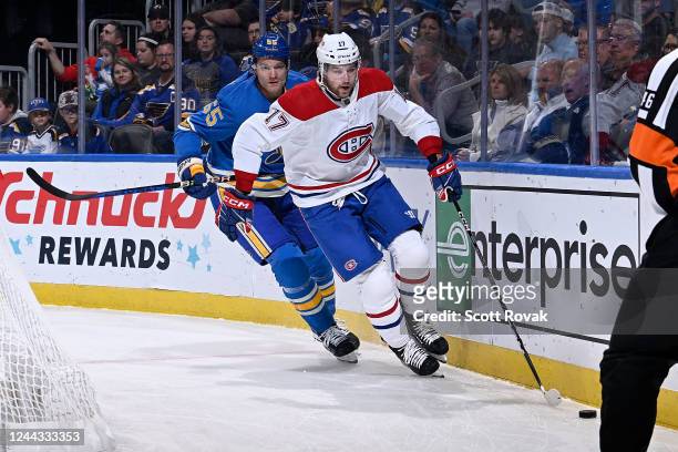 Josh Anderson of the Montreal Canadiens controls the puck as Colton Parayko of the St. Louis Blues pressures at the Enterprise Center on October 29,...