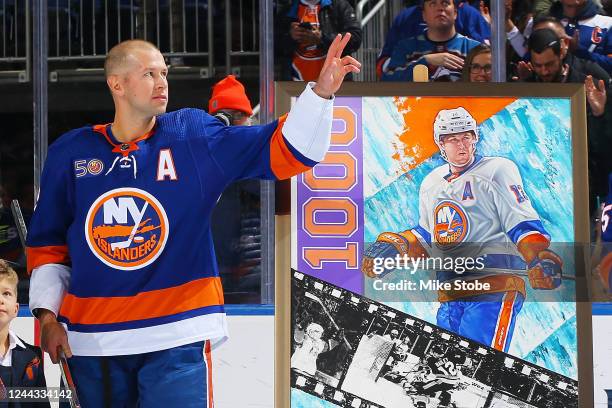 Josh Bailey of the New York Islanders waves to the crowd during a pregame ceremony to honor of his 1,000 NHL game played during a pregame ceremony at...