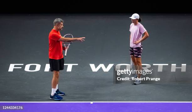 Iga Swiatek of Poland listens to coach Tomasz Wiktorowski during practice ahead of the 2022 WTA Finals, part of the Hologic WTA Tour, at Dickies...