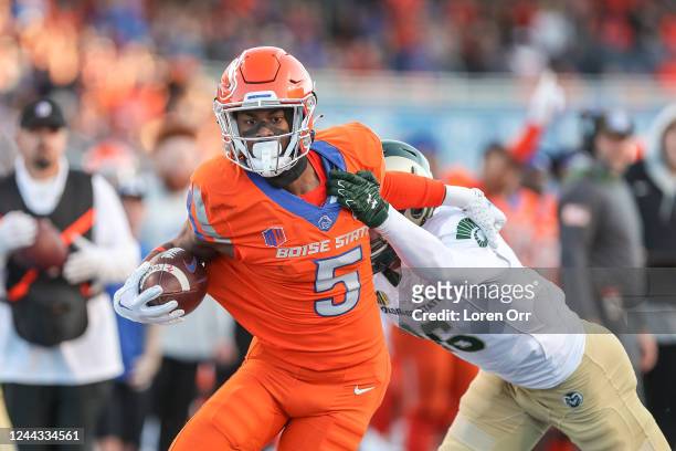 Wide receiver Stefan Cobbs of the Boise State Broncos breaks a tackle during the first half of the game against the Colorado State Rams at Albertsons...