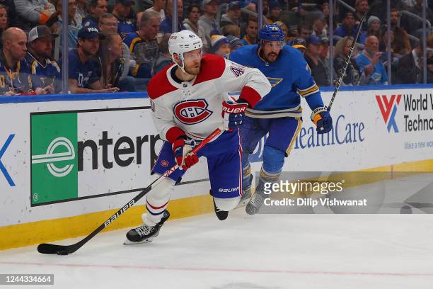 Joel Armia of the Montreal Canadiens controls the puck against Justin Faulk of the St. Louis Blues during the second period of the game at Enterprise...