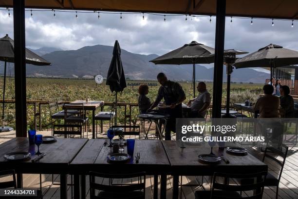 Guests eat at La Esperanza restaurant in Valle de Guadalupe, Baja California state, Mexico, on October 22, 2022. - Academics and local winegrowers...