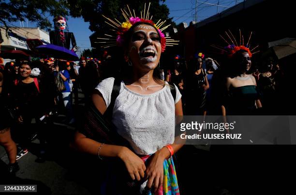 People take part in the Catrinas Parade, representing the character of La Catrina to commemorate the Day of the Dead, in Guadalajara, Mexico, on...