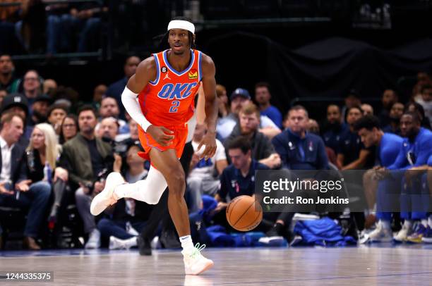 Shai Gilgeous-Alexander of the Oklahoma City Thunder brings the ball up the court against the Dallas Mavericks in the first half of the game at...