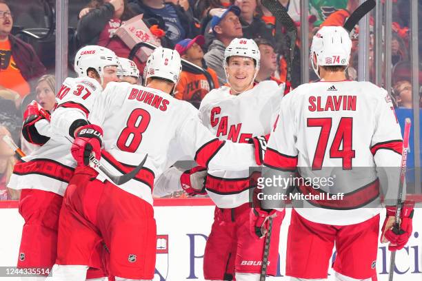Martin Necas of the Carolina Hurricanes celebrates with Andrei Svechnikov, Brent Burns, and Jaccob Slavin against the Philadelphia Flyers in the...