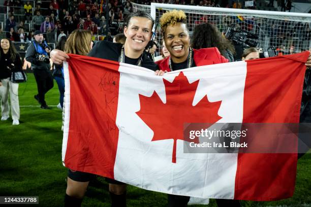 Christine Sinclair of Portland Thorns FC and Karina LeBlanc General Manager of the Portland Thorns hold up the Canadian National flag after winning...
