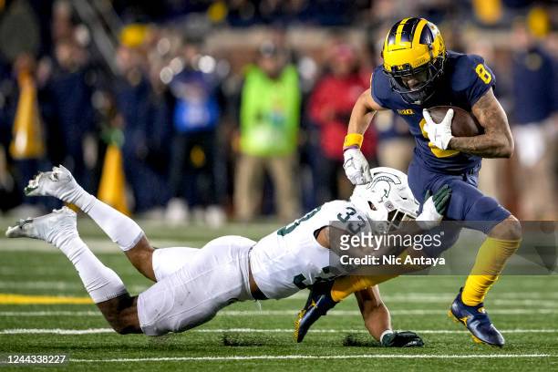 Kendell Brooks of the Michigan State Spartans tackles Ronnie Bell of the Michigan Wolverines during the third quarter at Michigan Stadium on October...