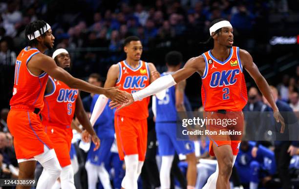 Shai Gilgeous-Alexander of the Oklahoma City Thunder and teammate Isaiah Joe celebrate a basket against the Dallas Mavericks in the second half of...