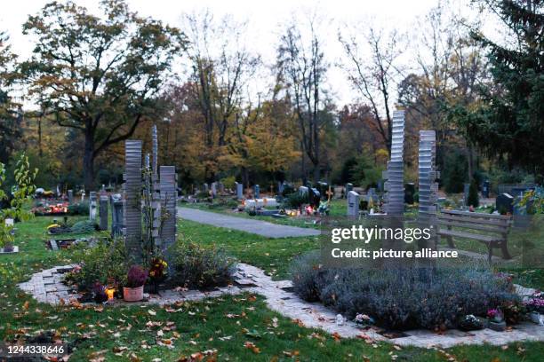 October 2022, Bavaria, Nuremberg: A niche wall for urns in the western cemetery. The All Saints' Day holiday and later the Sunday of the dead bring...