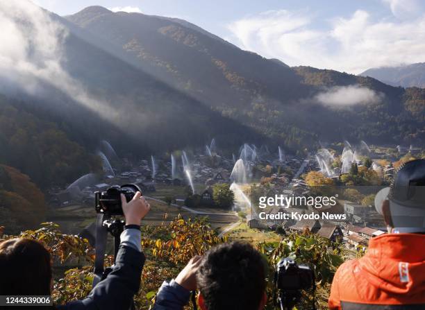 An annual water-discharge fire drill is held on Oct. 30 in Shirakawa-go, a World Heritage site famous for traditional "gassho-zukuri" thatched...