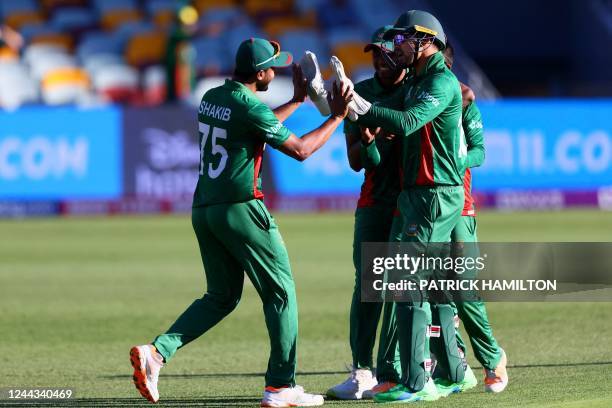 Bangladesh's Captain Shakib Al Hasan celebrates with the teammates during the ICC men's Twenty20 World Cup 2022 cricket match between Bangladesh and...