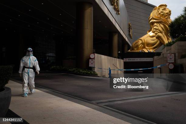 Police officer wearing personal protective gear at the entrance of MGM Cotai casino resort, developed by MGM China Holdings Ltd., placed under...