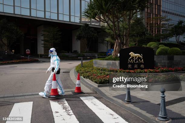 Police officer wearing personal protective guards the entrance of MGM Cotai casino resort, developed by MGM China Holdings Ltd., placed under...