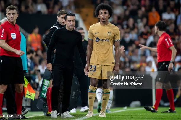 Barcelona's manager Xavi Hernandez and FC Barcelona's defender Jules kounde during Spanish La Liga match between Valencia CF and FC Barcelona at...