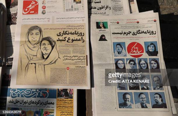 Kiosque in the Iranian capital Tehran on October 30 displays copies of the Hammihan newspaper, featuring on its cover a headline mentioning the...