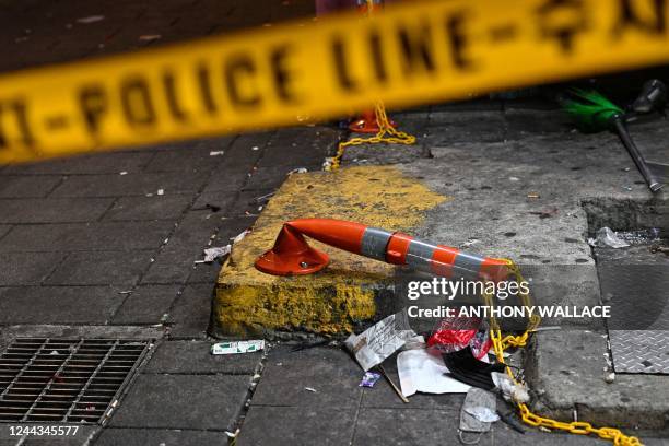 Damaged safety barrier is seen behind the police cordon in the alley, in which a stampede took place during Halloween celebrations late October 29,...