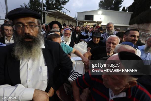 Israeli mourners carry the body of Ronen Hanania during his funeral in Jerusalem on October 30, 2022. - A Palestinian assailant shot dead an Israeli...