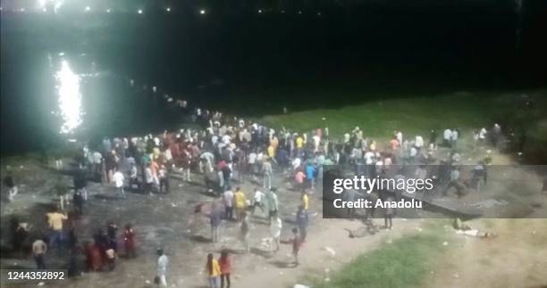 View of the site after a suspension bridge collapses in Indiaâs Gujarat state on October 30, 2022. Hundreds plunged into river after the bridge...