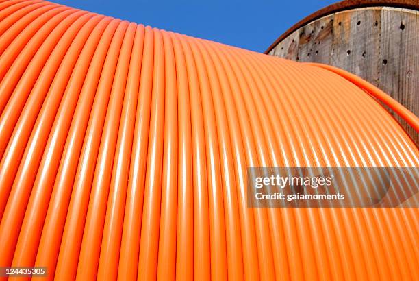 orange cable - bundle stock pictures, royalty-free photos & images