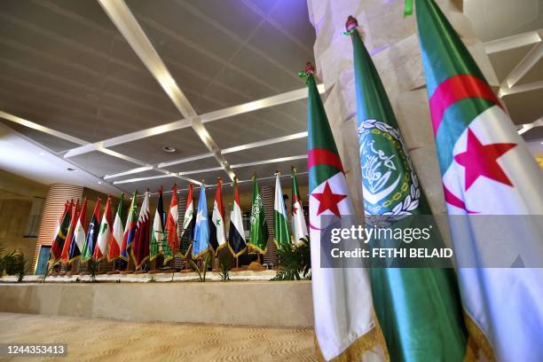 Flags of Arab League nations are set up at the convention center slated to host the league's Heads of State summit, in Algeria capital Algiers, on...