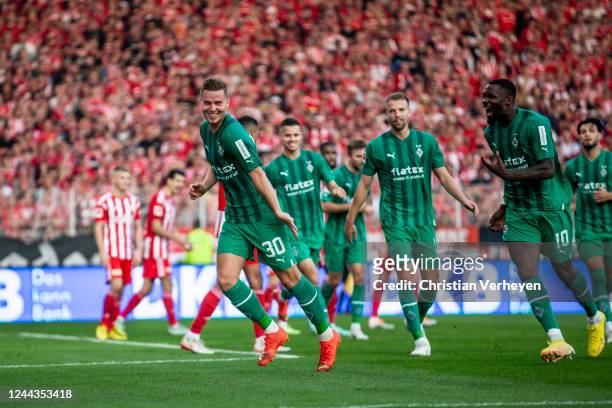Nico Elvedi of Borussia Moenchengladbach celebrate with team mates after he score his teams first goal during the Bundesliga match between 1. FC...